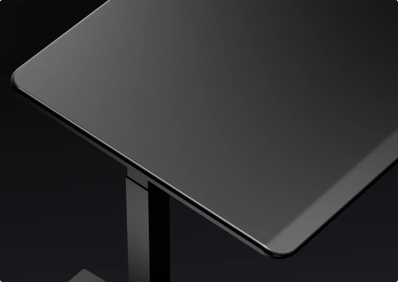 Render of the black top's bevelled corner and leg on a dark background.