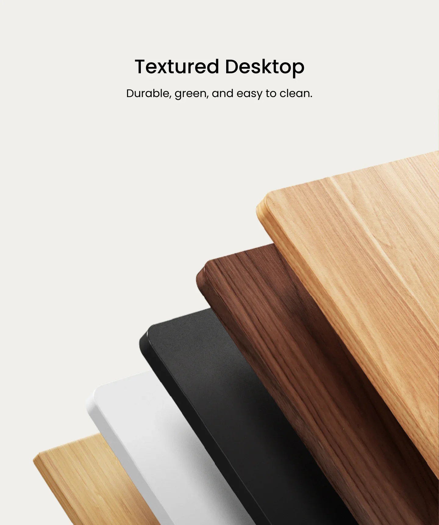Fanned stack of laminate desktops in light oak, walnut, black, white and bamboo tones, headed "Textured Desktop".