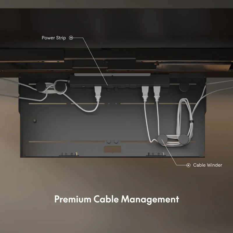 View from below into the open cable box showing a power strip with plugs inserted and a cable winder, with callouts and a caption.
