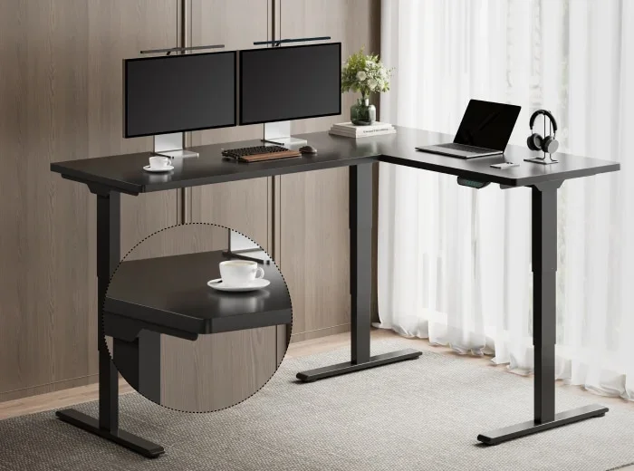Black E7L-Lite L-desk with dual monitors, laptop and headphones in a wood-panelled room, with a circular inset zooming on a steady cup at the desktop edge; no text.
