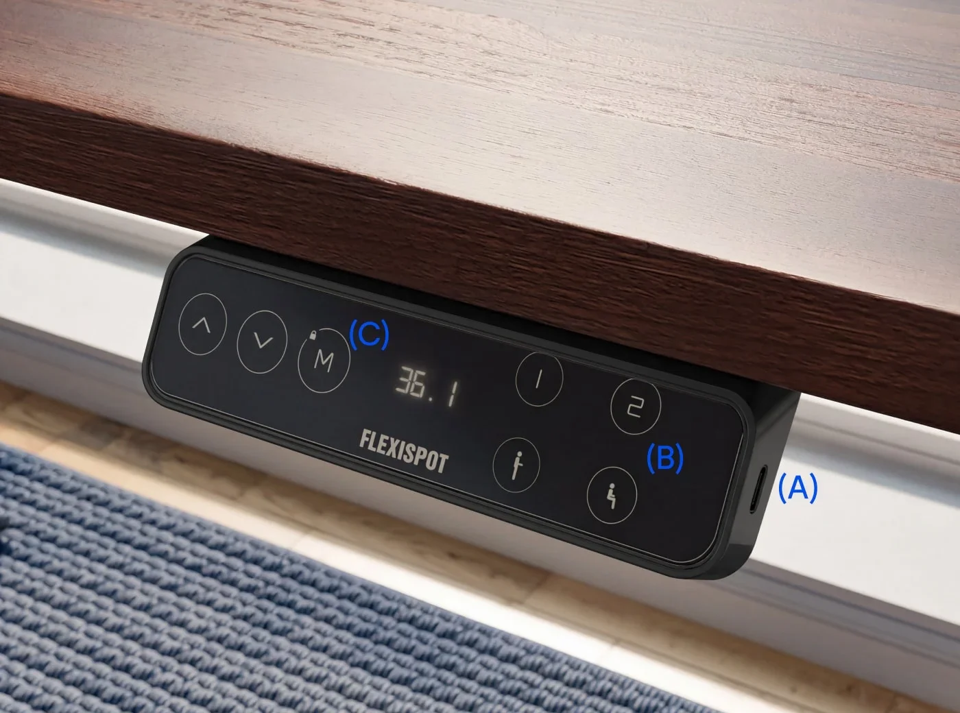 The black LCD keypad under a wood top showing a height readout, with lettered callouts.