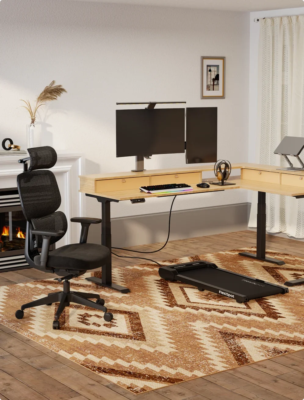L-shaped black-frame desk with a bamboo top and drawer riser, dual monitors, mesh chair and a walking pad on a patterned rug beside a fireplace.