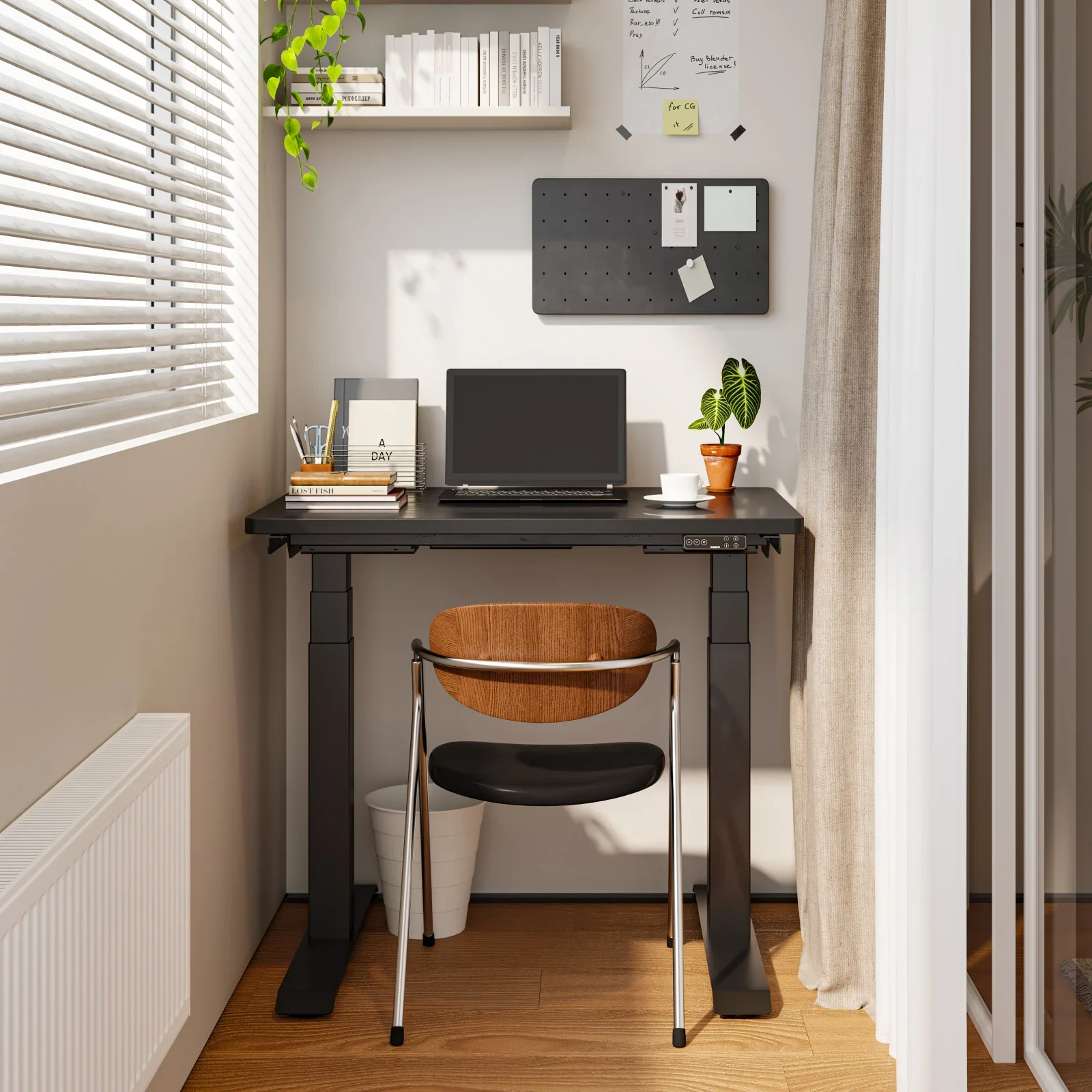 Black-frame E7 Mini with a black top in a narrow window nook with a pegboard, shelf, laptop, plant and a bentwood chair.