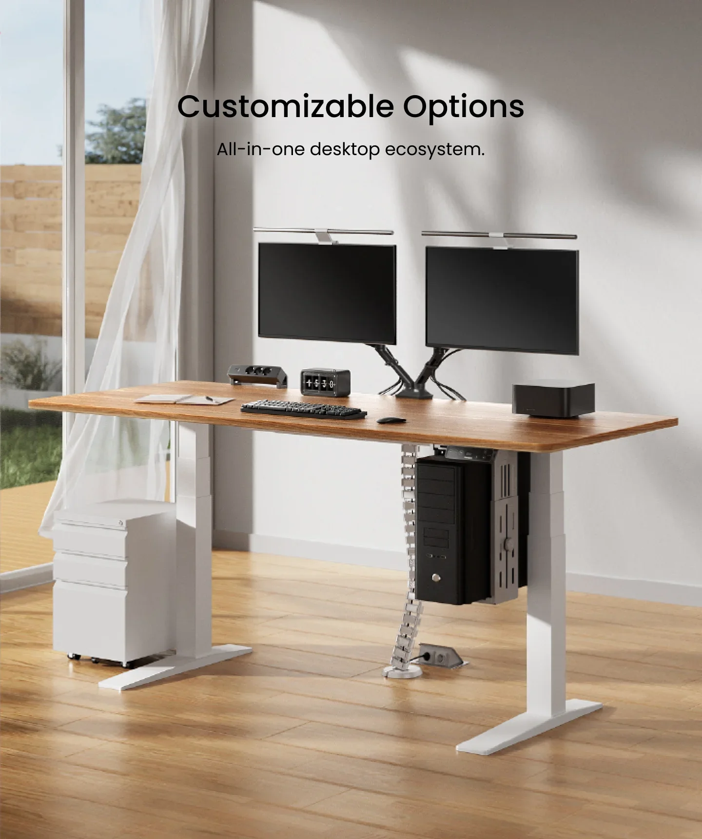 White-frame desk with walnut-look top, dual monitors on arms, CPU holder, cable spine and white pedestal in a sunlit room, headed "Customizable Options".