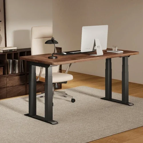 E7 Plus Max with a walnut top and black frame in a study on a grey rug with an iMac, a black lamp and a cream office chair.