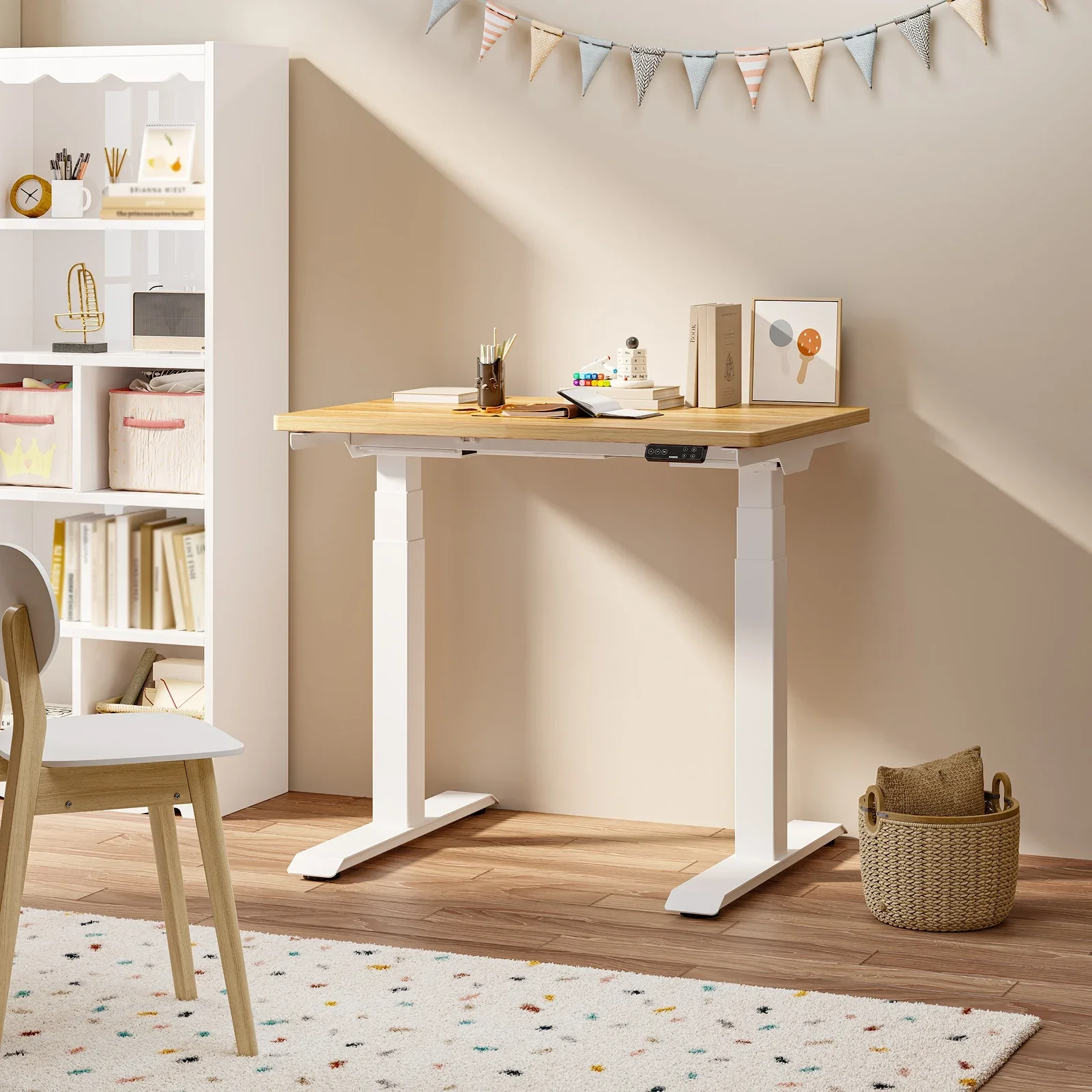 White-frame E7 Mini with a light oak top in a bright child's room with bunting, a white bookcase, speckled rug and a wooden chair.