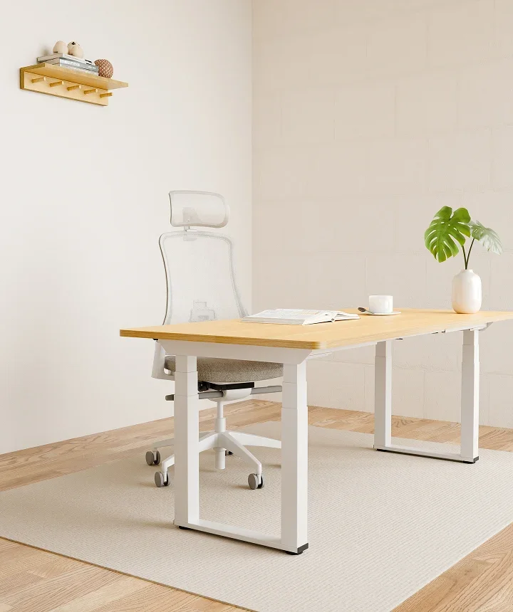 White-frame E7 Plus Max with a light oak top and white mesh chair in a minimal bright room with a wall shelf.
