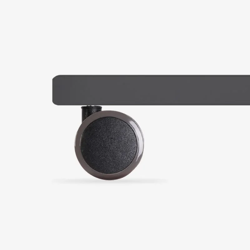 Single dark-brown caster fitted under a grey desk foot, side view on white.