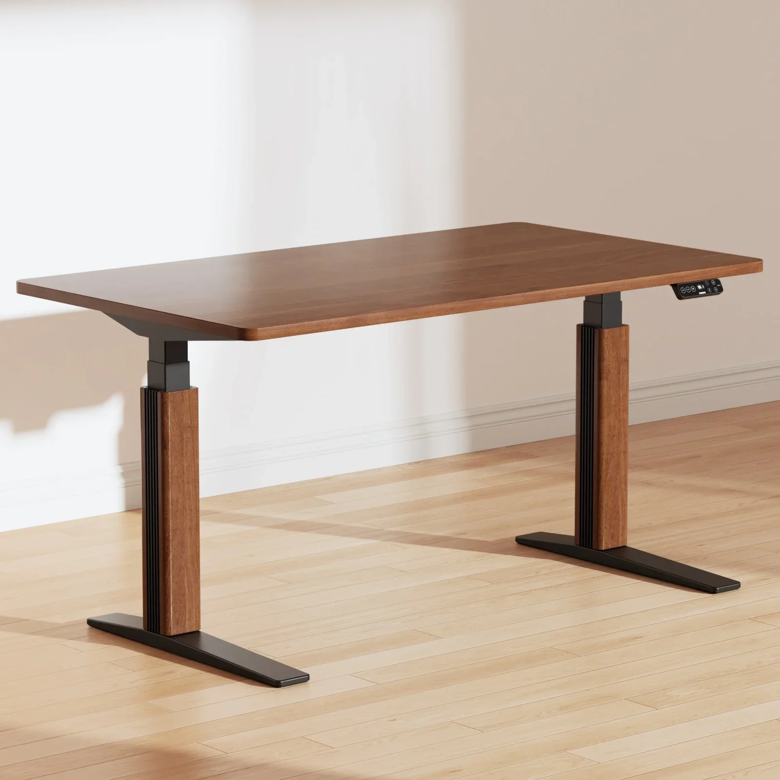 E7 Pro with a walnut top, black frame and walnut leg covers standing on a light wood floor against a white wall, keypad visible.