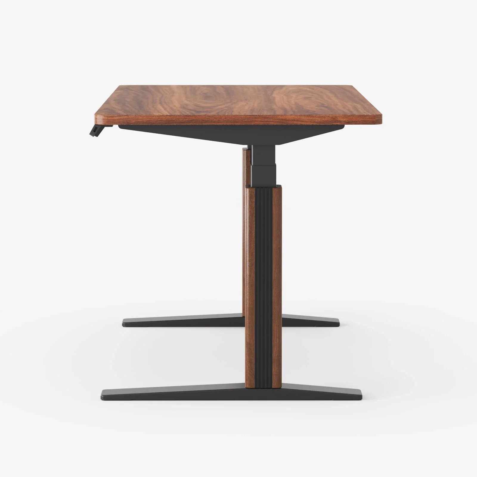 Side view of an E7 Pro desk with a walnut top and walnut leg covers on black T-feet against a white background.